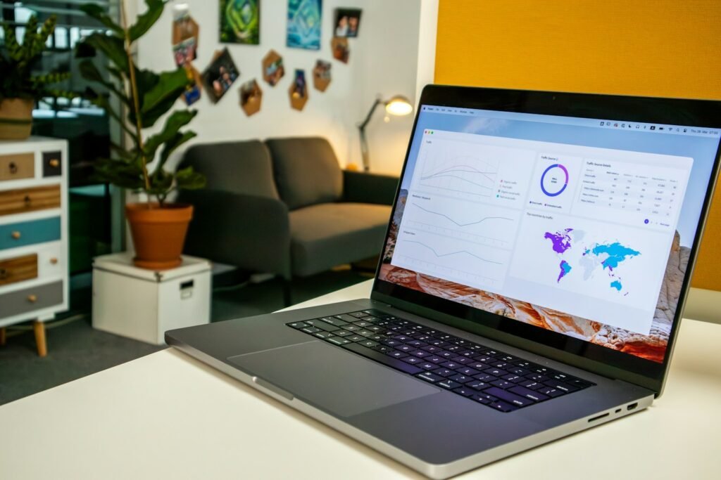 a laptop computer sitting on top of a white table